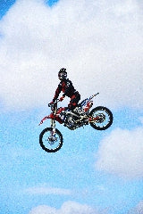 Stunt Man Riding Dirt Bike on Air Wall Photo Print